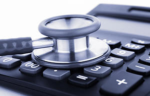 stethoscope on calculator